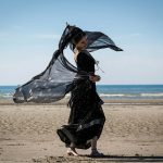 woman dancing on seashore