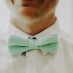 man in white dress shirt with black bowtie