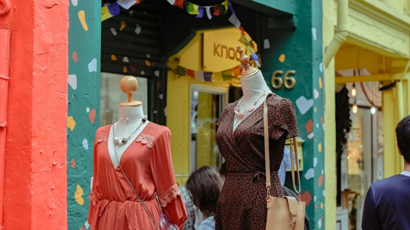people standing near dress outdoor during daytime